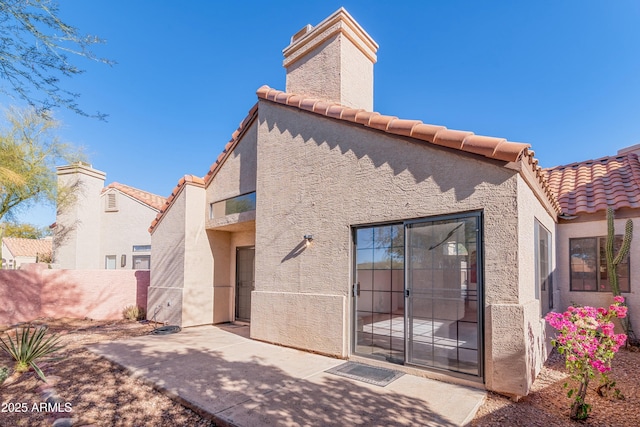 rear view of house with a patio area