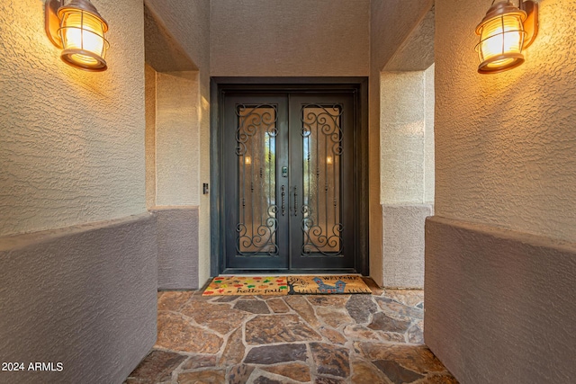 doorway to property featuring french doors