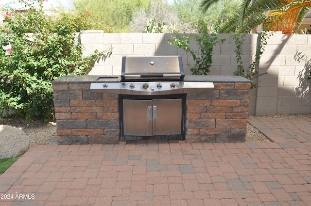 view of patio featuring a grill