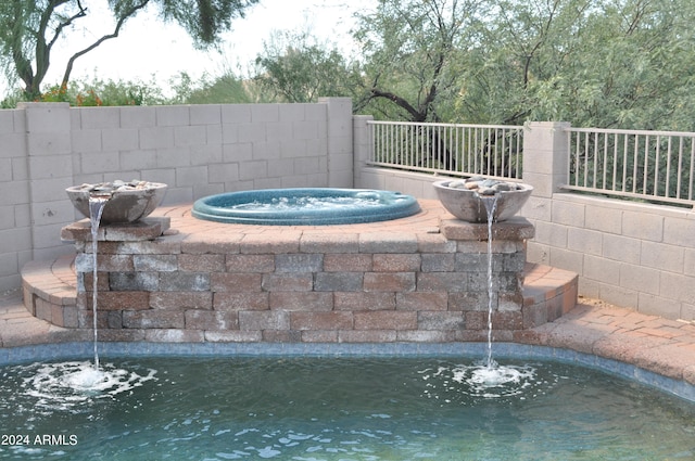 view of swimming pool featuring pool water feature