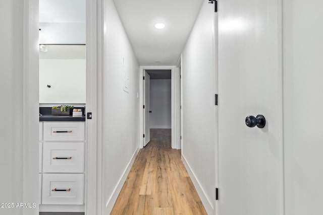 corridor featuring light hardwood / wood-style floors