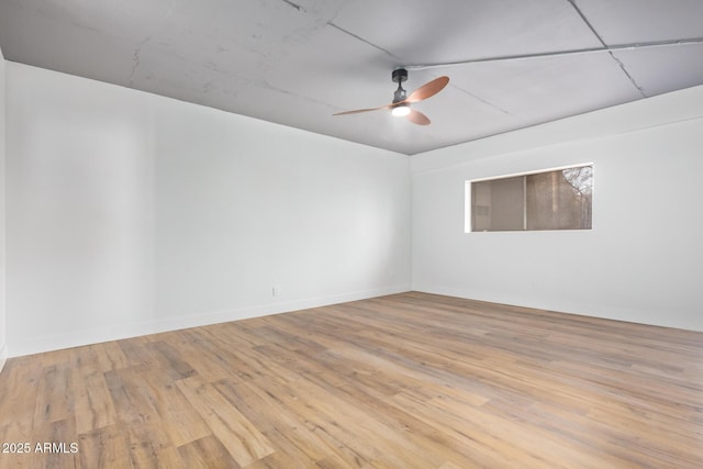 spare room with ceiling fan and light hardwood / wood-style flooring