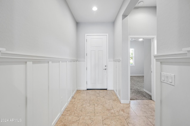 hallway with light carpet