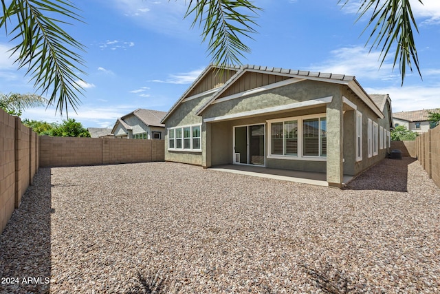 rear view of property featuring a patio area