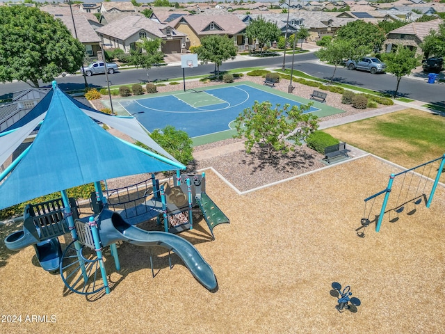 view of basketball court with a playground