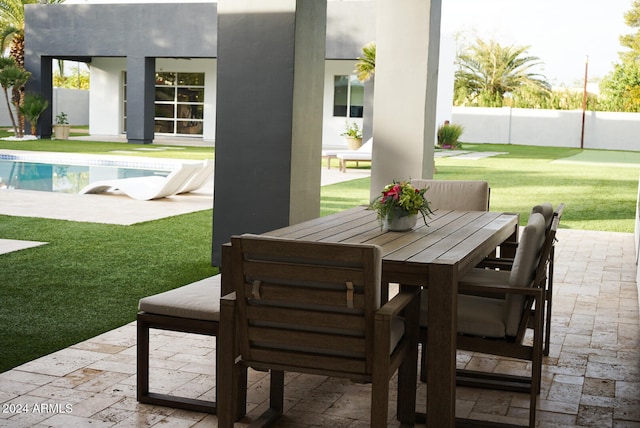 view of patio / terrace with a fenced in pool