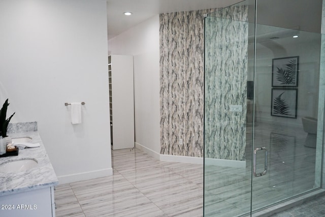 bathroom featuring vanity and an enclosed shower