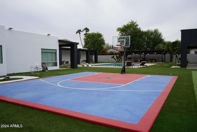 view of sport court with a pergola and a fenced in pool