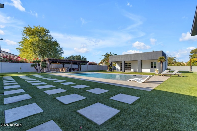 view of pool featuring a lawn and a patio area