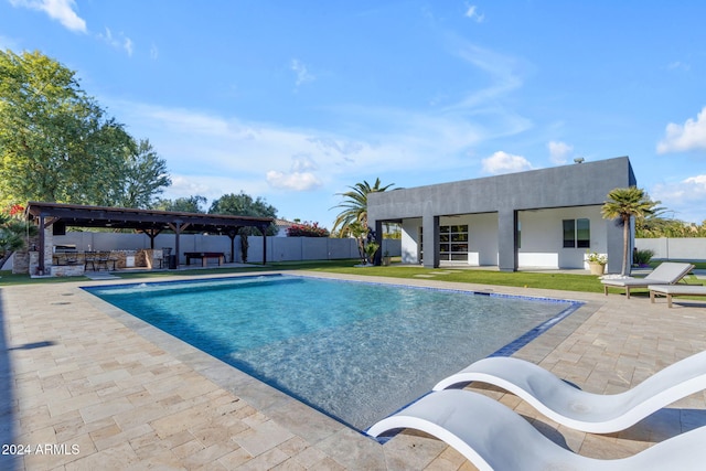 view of swimming pool with a patio area and exterior bar