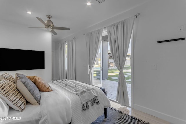 bedroom with access to exterior, wood-type flooring, and ceiling fan