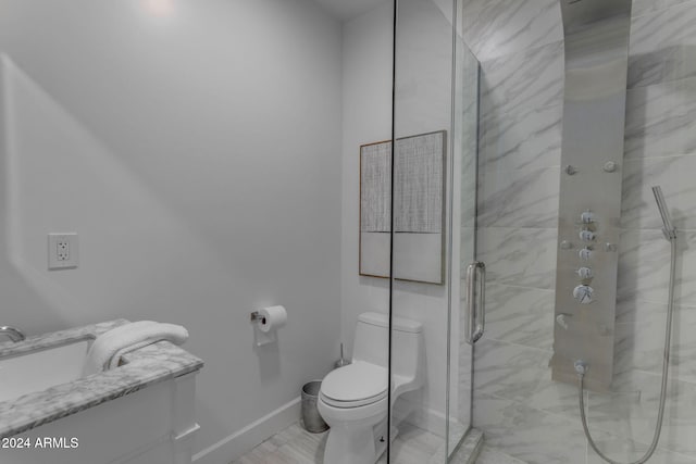 bathroom with toilet and walk in shower