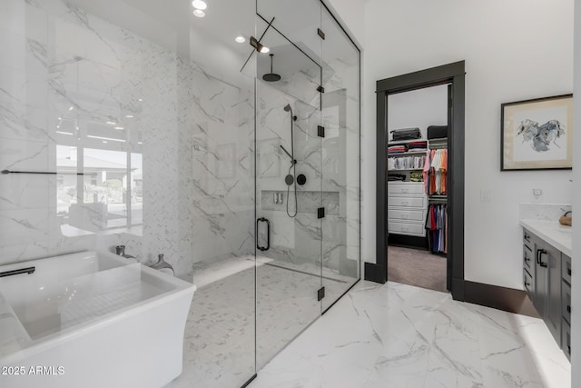 bathroom with vanity and separate shower and tub