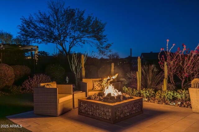 patio at night with a fire pit