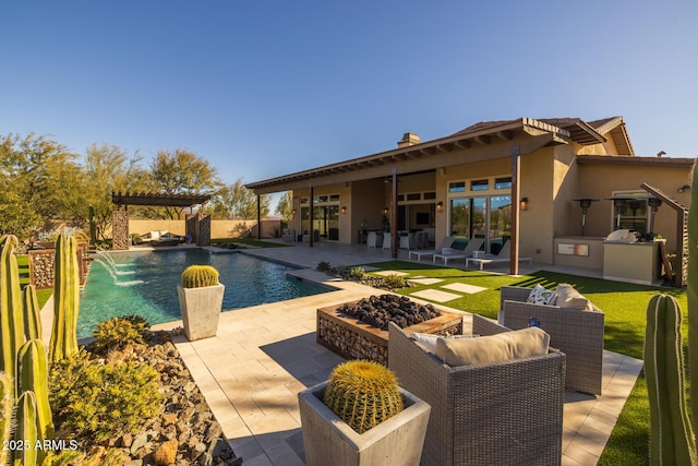 view of pool featuring a pergola, a patio area, area for grilling, an outdoor living space with a fire pit, and pool water feature