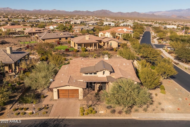 birds eye view of property with a mountain view