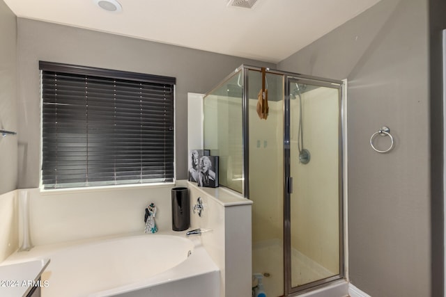 bathroom featuring vanity and separate shower and tub