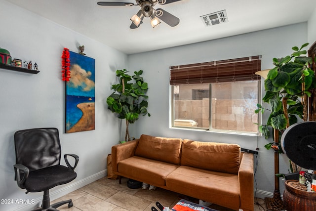 sitting room featuring ceiling fan