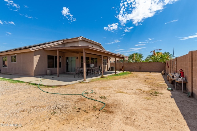 rear view of house featuring a patio area