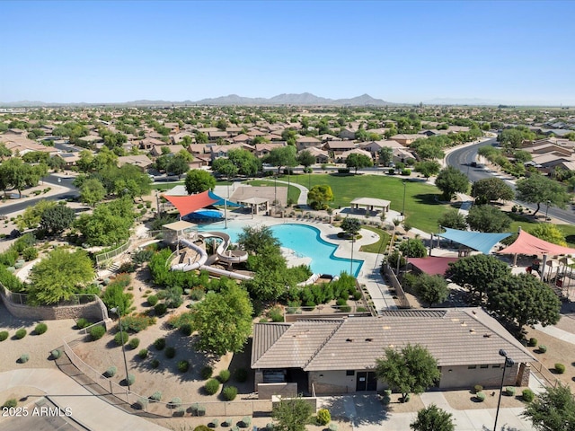 birds eye view of property with a mountain view