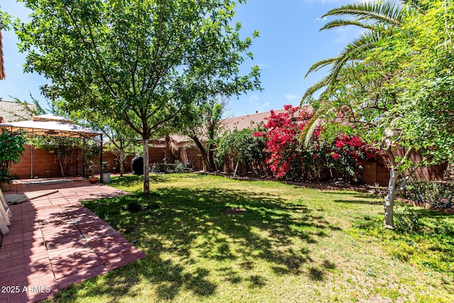 view of yard featuring a gazebo, a fenced backyard, and a patio