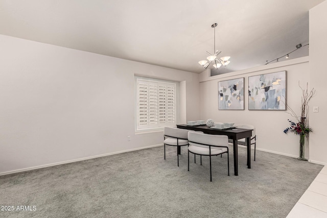 carpeted dining space featuring baseboards, tile patterned floors, and a chandelier
