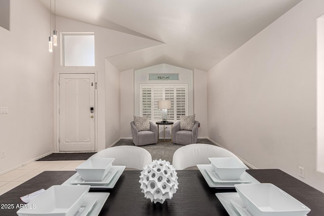 interior space with baseboards and vaulted ceiling