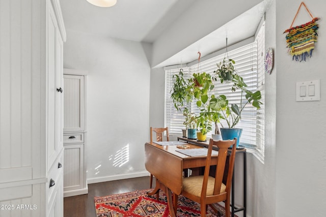 office space with dark wood-type flooring