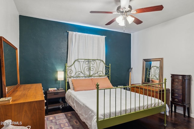 bedroom featuring hardwood / wood-style flooring and ceiling fan