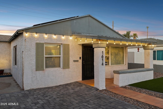 view of front of property with a patio