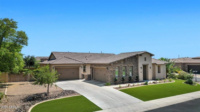 6917 E Ingram Cir, Mesa, AZ 85207 - view of front of property featuring a tile roof, concrete driveway, a garage, stucco siding, and stone siding