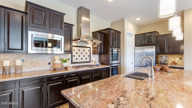 6917 E Ingram Cir, Mesa, AZ 85207 - kitchen with wall chimney exhaust hood, stainless steel appliances, dark brown cabinetry, tasteful backsplash, and light stone countertops