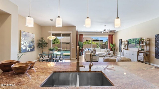 6917 E Ingram Cir, Mesa, AZ 85207 - kitchen featuring stone counters, a ceiling fan, decorative light fixtures, and open floor plan