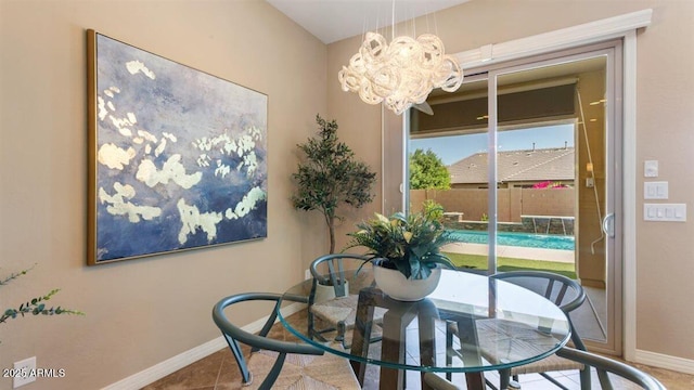 6917 E Ingram Cir, Mesa, AZ 85207 - dining area featuring baseboards and a chandelier