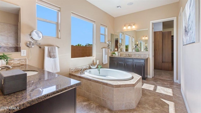 6917 E Ingram Cir, Mesa, AZ 85207 - bathroom featuring two vanities and a bath