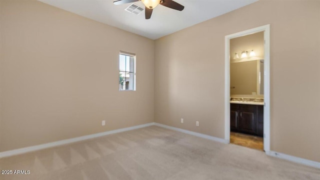 6917 E Ingram Cir, Mesa, AZ 85207 - unfurnished bedroom with light colored carpet, connected bathroom, and ceiling fan