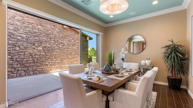 6917 E Ingram Cir, Mesa, AZ 85207 - dining space with wood finished floors, crown molding, and recessed lighting