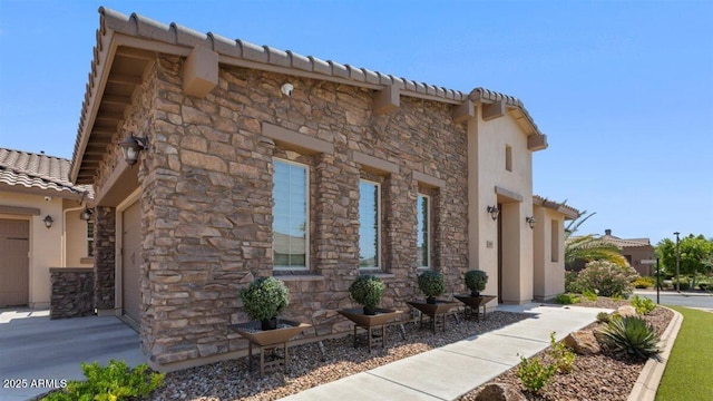 6917 E Ingram Cir, Mesa, AZ 85207 - view of side of home featuring a tiled roof, stucco siding, and stone siding
