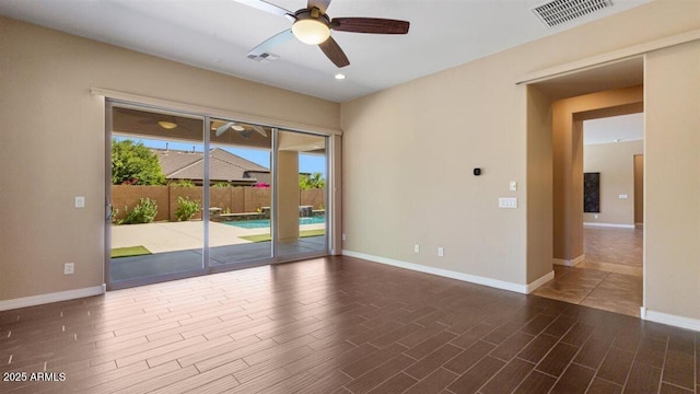 6917 E Ingram Cir, Mesa, AZ 85207 - unfurnished room featuring ceiling fan, plenty of natural light, wood finished floors, and recessed lighting