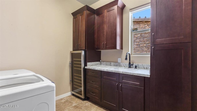 6917 E Ingram Cir, Mesa, AZ 85207 - washroom featuring wine cooler, cabinet space, and washer / dryer