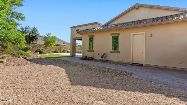 6917 E Ingram Cir, Mesa, AZ 85207 - back of house featuring stucco siding and a patio