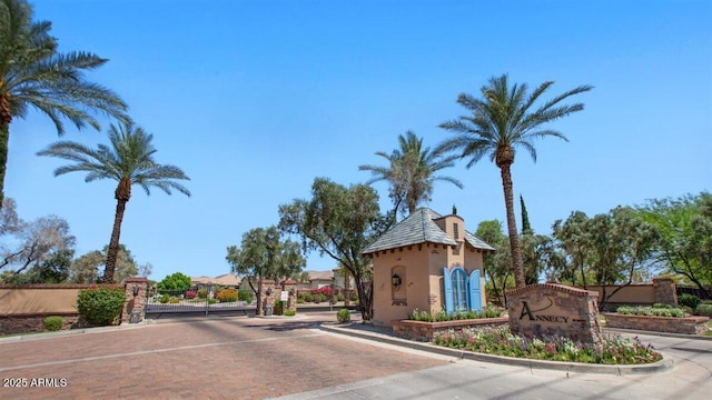 6917 E Ingram Cir, Mesa, AZ 85207 - view of decorative road featuring curbs, a gated entry, and a gate