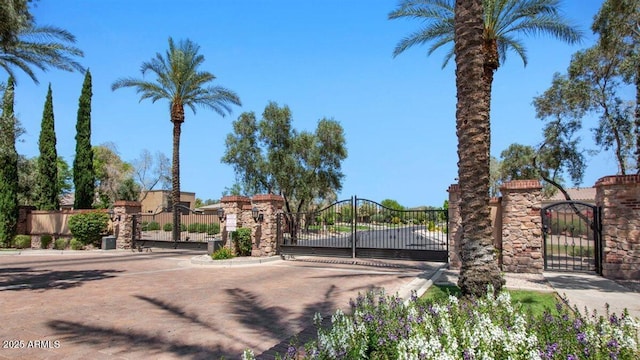6917 E Ingram Cir, Mesa, AZ 85207 - view of street with a gate, a gated entry, and curbs