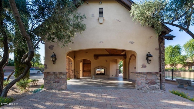 6917 E Ingram Cir, Mesa, AZ 85207 - view of front facade with stucco siding, stone siding, and decorative driveway