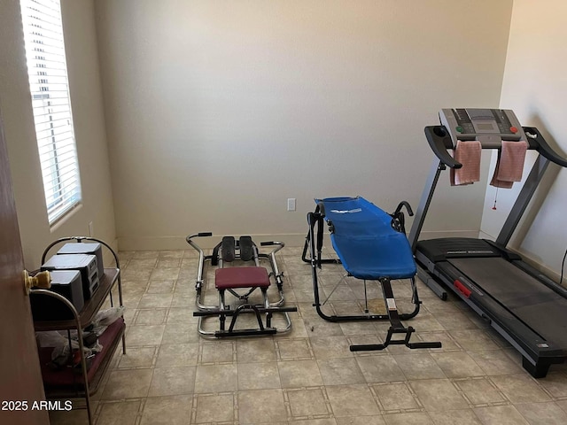 exercise room with baseboards