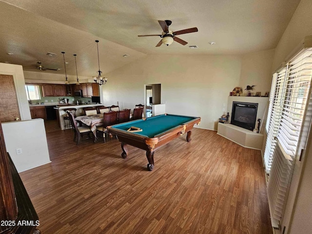 recreation room with a glass covered fireplace, billiards, a ceiling fan, and wood finished floors