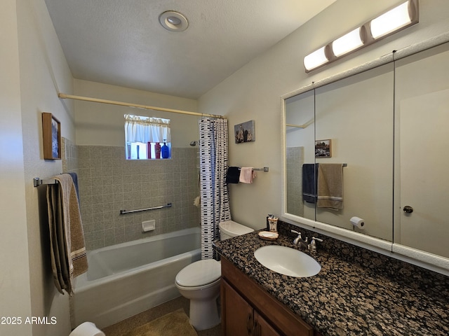 bathroom with vanity, shower / tub combo with curtain, and toilet