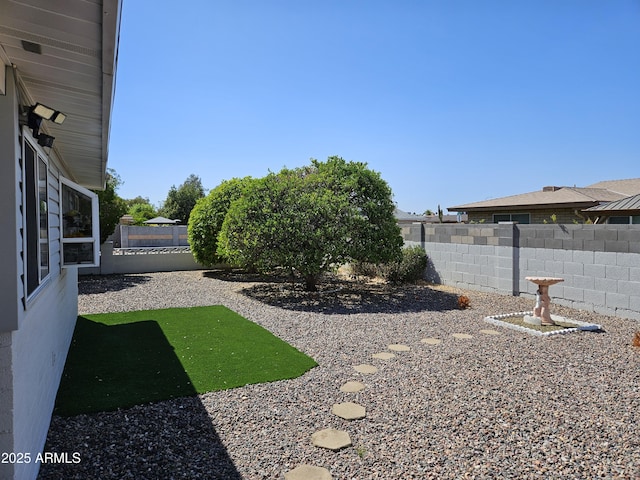 view of yard featuring a fenced backyard
