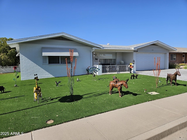 view of front of house with brick siding, a garage, a front yard, covered porch, and driveway