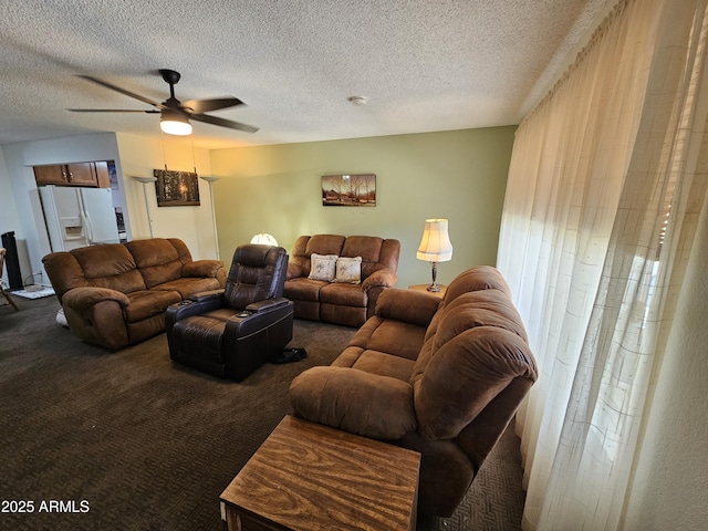 carpeted living room with a textured ceiling and ceiling fan